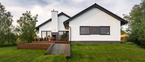 Stock-White-Minimalistic-House-With-Black-Roof-AdobeStock163839984.jpg